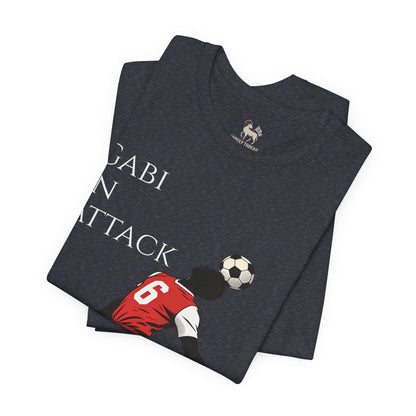 Red colorway of the Gabi at the Back, Gabi in Attack Arsenal chant tee by Unruly Thread — match-day terrace shirt honoring Gabriel Magalhães.
