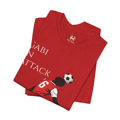 Three-quarter view of the Gabi at the Back, Gabi in Attack Arsenal chant tee — cartoon Arsenal number 6 design, by Unruly Thread.