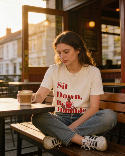 Hanging view of the Sit Down, Be Humble Arsenal tee by Unruly Thread.