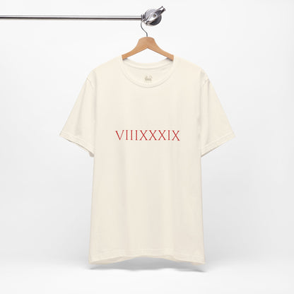 Close-up of the chest print on the Invincibles to Unforgettables tee — Roman numerals VIIIXXXIX, Arsenal champions shirt, Unruly Thread.